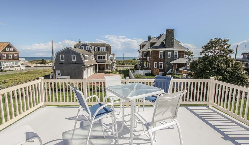 Photo taken from a vacation home's deck, facing the ocean.